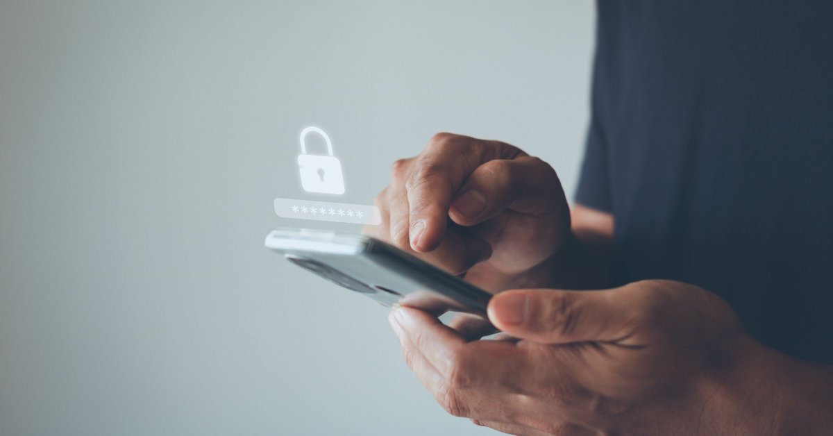 A close-up of someone holding a cell phone and tapping the screen. A small lock and password graphic hovers above the phone.