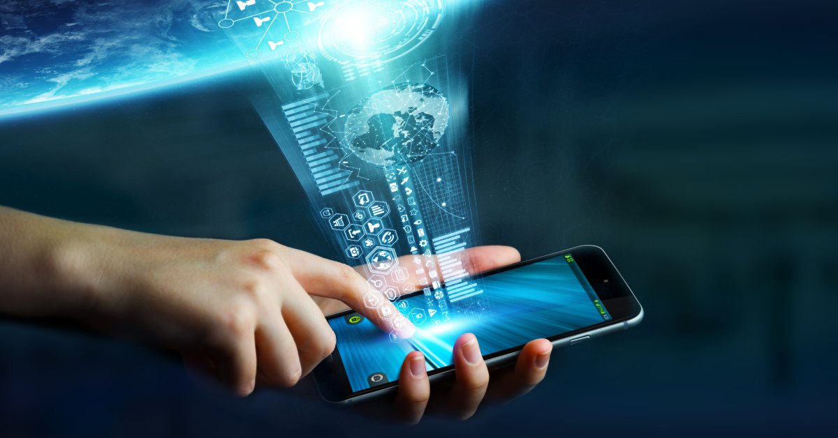 Someone holds a cell phone in their hands and points a finger at the screen. A stream of icons and graphics comes from the screen.