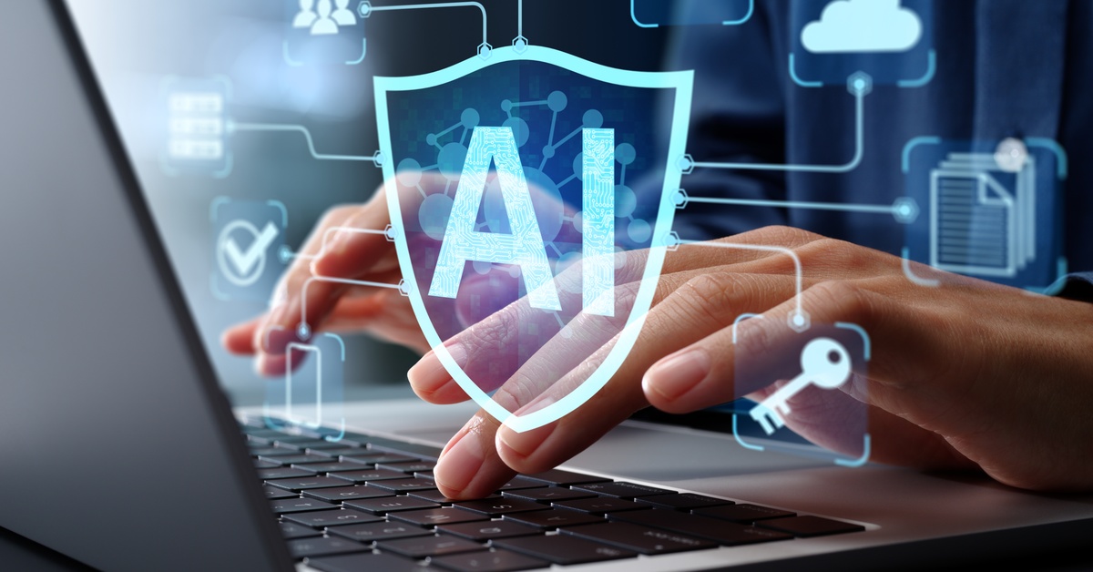 A close-up of someone typing on a keyboard. A graphic that says "AI" with several other icons hovers over the person's hands.